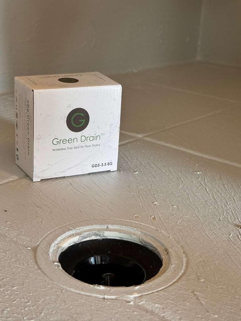 Green Drain installed in a round shower drain