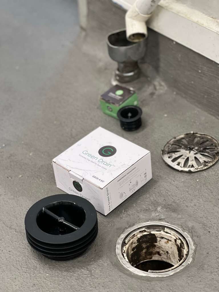 Green Drain box and insert next to an open floor drain during installation